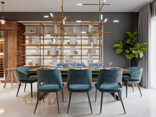 istock Large modern dining table in a trendy style, dining area in a studio apartment. Wooden table top, fabric blue chairs. 1263549191