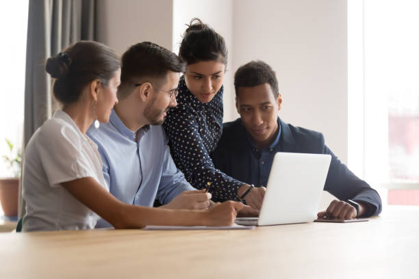 istock Multiracial successful team working together on project in office 1263550233