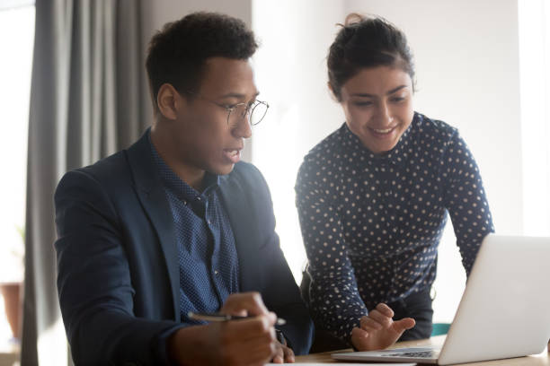 istock Young multiracial black and indian team working at office. 1263550264
