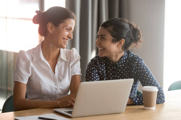 istock Happy millennial multiracial employees working together at office. 1263550278