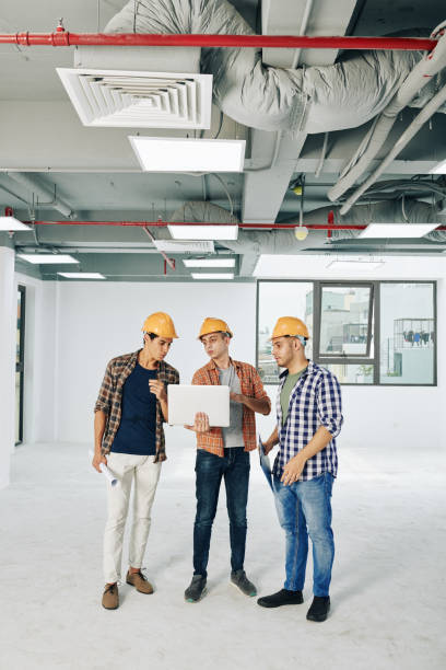 istock Engineers discussing scheme of service lines 1263550473