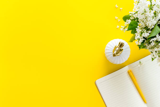 istock Jasmine flowers bouquet with cup tea and notepad top view 1263550572