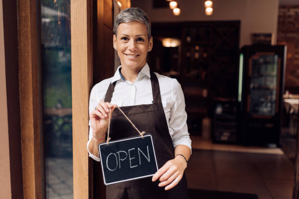 istock Happy woman reopening her restaurant 1263552096