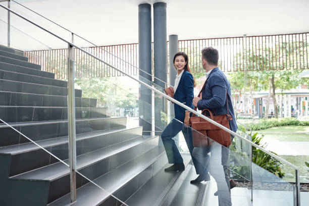 istock Colleagues walking up the stairs 1263552193