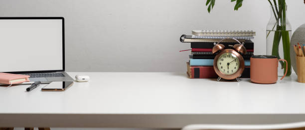 istock Workspace with laptop, stationery, copy space, books and decorations on white table, clipping path. 1263553051