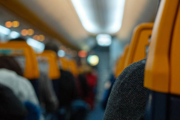 istock Airplane Interior with passengers. Airplane cabin is full of passengers. Flight cancellation or start of air transportation. Blurred background for your text. End of covid 19 quarantine 1263553241