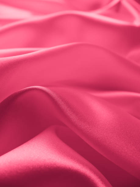 istock Beautiful elegant wavy light pink satin silk. 1263553764