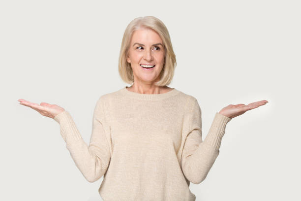 istock Smiling mature woman compare options considering pros and cons 1263557614