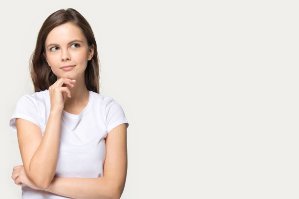 istock Pensive millennial girl stand near blank copy space 1263557672