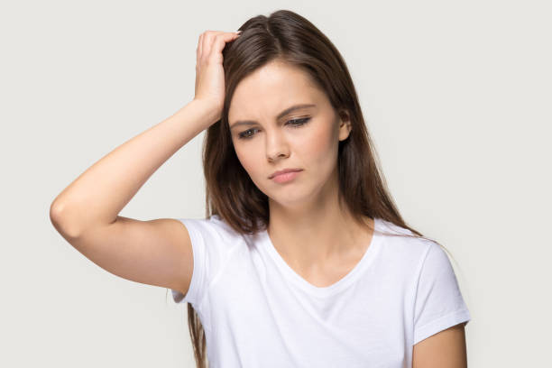 istock Tired young woman touch head suffering from migraine 1263557676