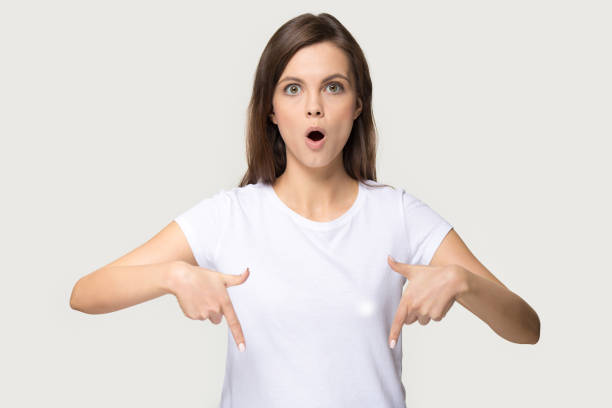 istock Surprised millennial girl point down sharing good offer 1263557689