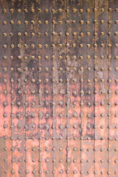istock Old grunge metal wall in an old temple 1263558098
