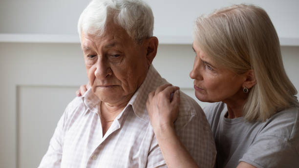 istock Caring senior wife hug comfort upset elderly husband 1263560208
