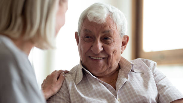 istock Smiling mature man talk with caring wife 1263560212