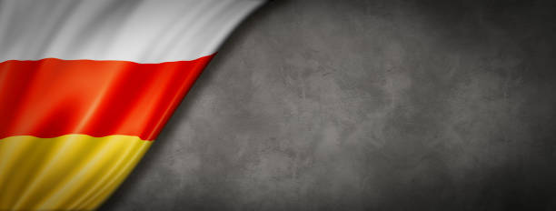 istock South Ossetia flag on concrete wall banner 1263562096