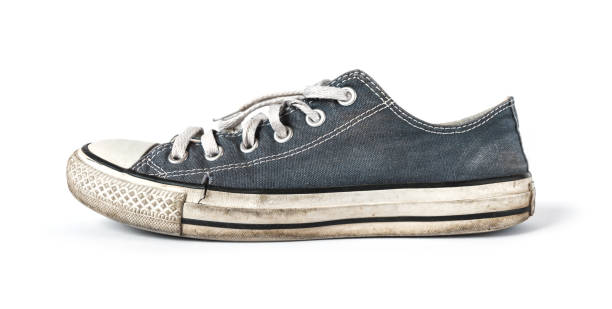 istock Old blue sneaker isolated on white background 1263562250