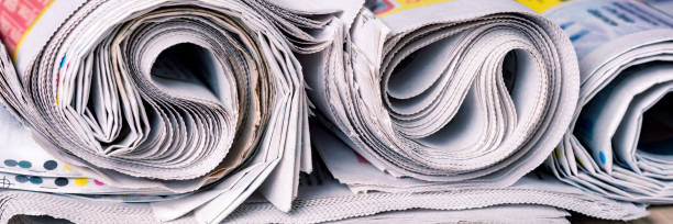 istock Newspapers, world news information concept, close-up, panoramic 1263562322