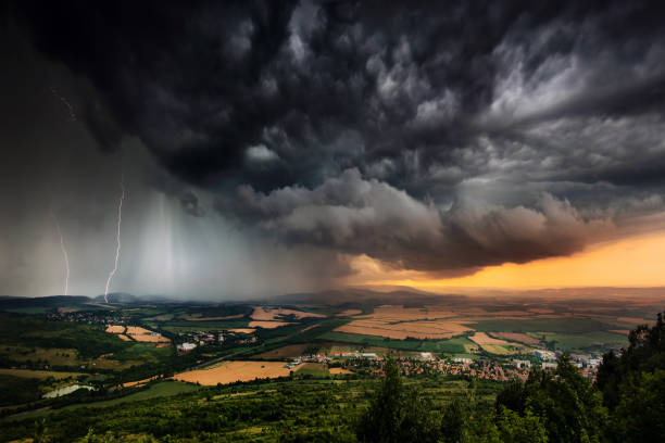 Beautifully structured thunderstorm in Bulgarian Plains A severe thunderstorm shelf cloud races across the country side on a summer afternoon dramatic sky stock pictures, royalty-free photos & images