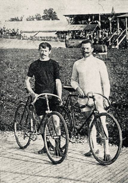istock Cyclists Lucien Lesna - Josef Fischer, standing next to her bikes on a cycle track 1263563324