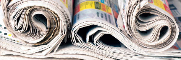 istock Newspapers, world news information concept, close-up, panoramic 1263563389