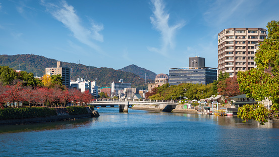 Hiroshima Cityscape Panorama under sunny summer skyscape. View over the River Ota to the Hiroshima Atomic Bomb Dome next to the Ota River. Hiroshima, Japan, East Asia, Asia.