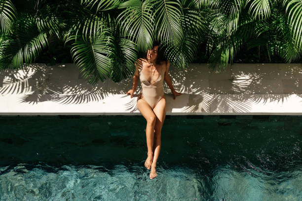 istock Young black woman relaxing at spa pool. 1263564323