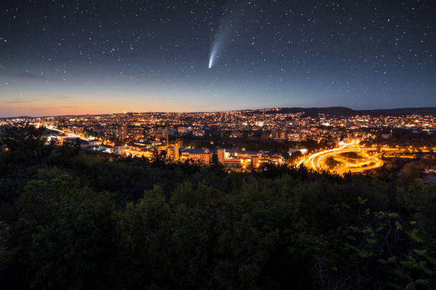 Comet Neowise over the city at night stock photo