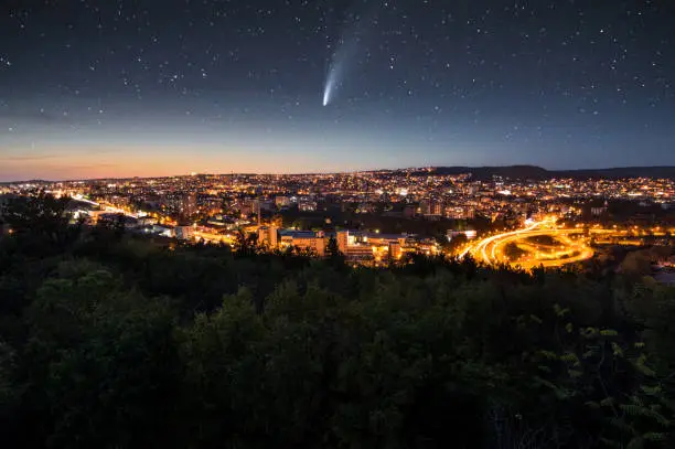 Photo of Comet Neowise over the city at night