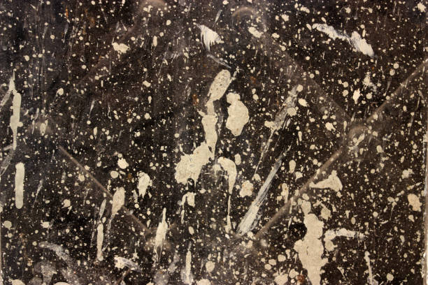 istock Window bespattered with paint and concrete 1263565048