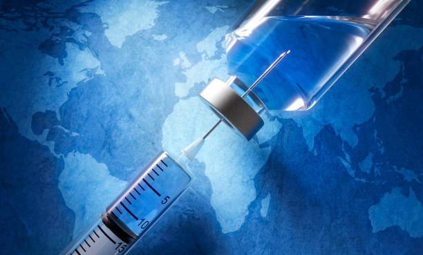 Close-up of medical syringe with vaccine Covid-19, Coronavirus vaccine in vial with syringe on blue earth map background 21st century stock pictures, royalty-free photos & images