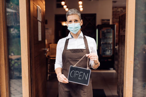 istock Happy female owner reopening her cafeteria 1263568023