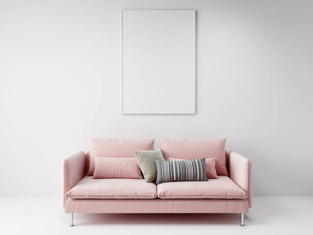 istock pink sofa in front of the vertical empty mockup picture frame hanging on the white wall, 3D background concept 1263569553