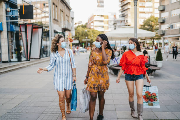 istock Cheerful friends enjoy shopping 1263570093