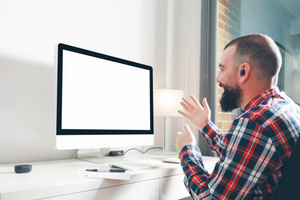 istock Young man having video call in font of computer with blank screen 1263573785