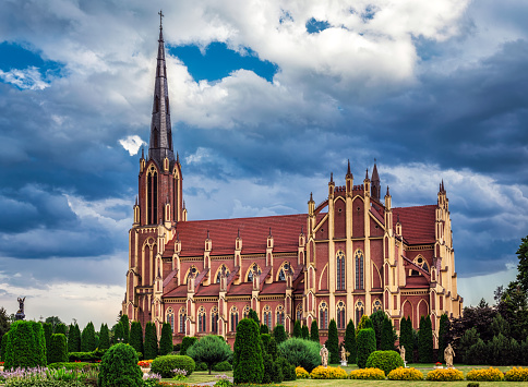 Stormy clouds over The Church of the Holy Trinity is a Catholic church in the agro-town Gervyaty, Grodno region, Belarus. Built in 1899-1903 in the neo-gothic style.