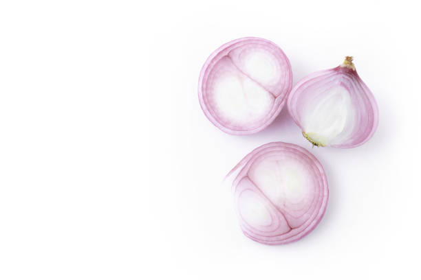 istock Red sliced onion isolated on white background 1263575662