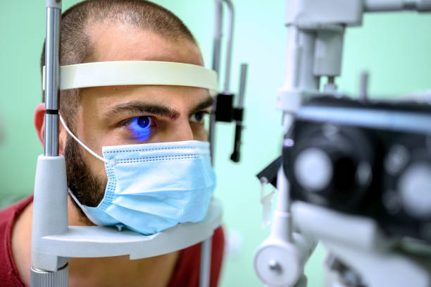 istock Man having an eye exam at ophthalmologist's office 1263576053