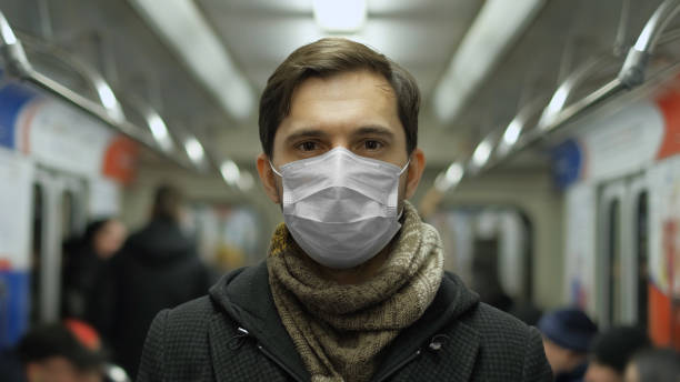 istock People Look at Camera. Coronavirus. Passenger Train Metro. Subway Corona Virus. 1263576949