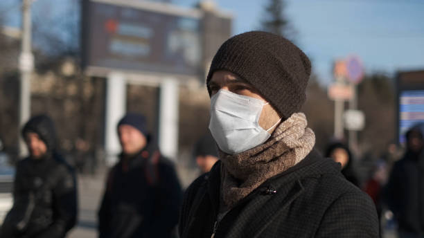 istock Man in mask coronavirus 2019-ncov. Corona virus covid-19. Environment pollution. 1263576963