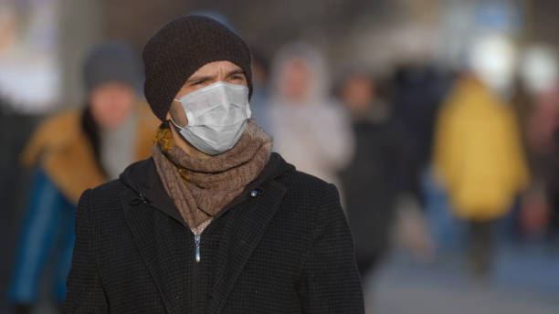 istock Man in mask coronavirus 2019-ncov. Corona virus covid-19. Environment pollution. 1263576964