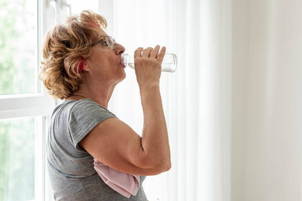 istock Senior women exercise at home 1263577585