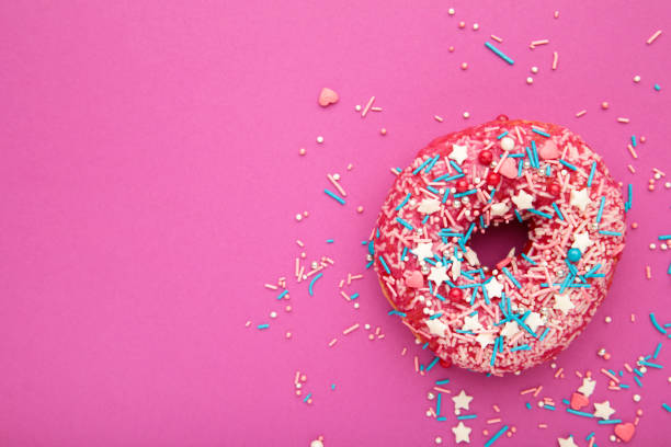 istock Donut with icing on pink background. Sweet donuts. Glazed donut. 1263579574