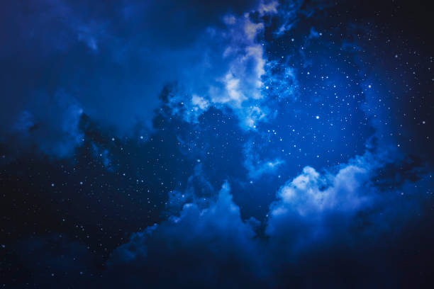 Starry night sky with stars and moon in cloudscape background