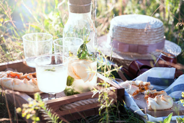 Summer - lemonade with lemon and mint with apricot biscuit and a basket\