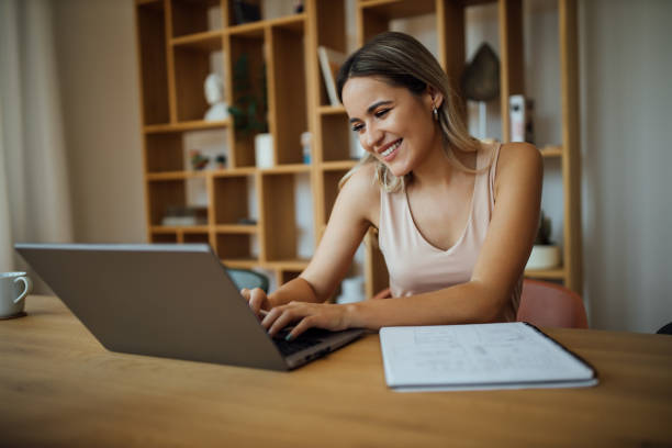 istock Portrait of a beautiful young woman using laptop computer. 1263582476