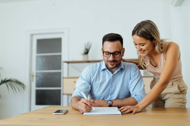 istock Beautiful couple at home office, portrait. 1263582482