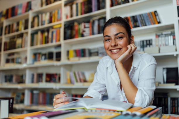 istock Happy girl using her literature. 1263582522