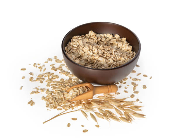 istock Rolled oats, healthy breakfast cereal oat flakes isolated on white 1263583623