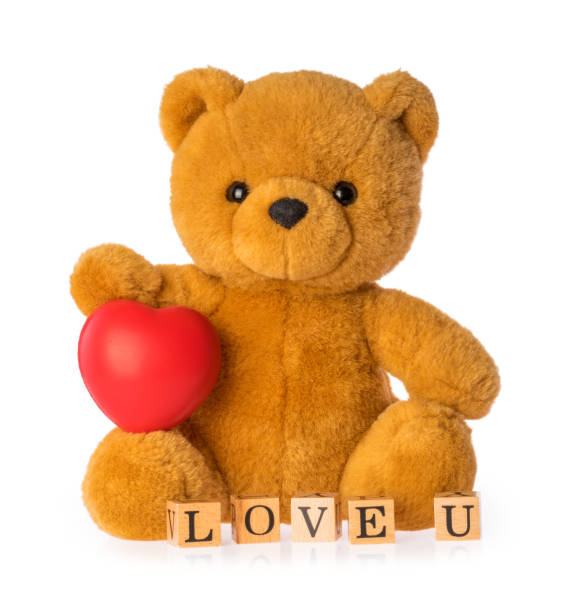 istock Teddy bear with heart love concept on white background 1263589628