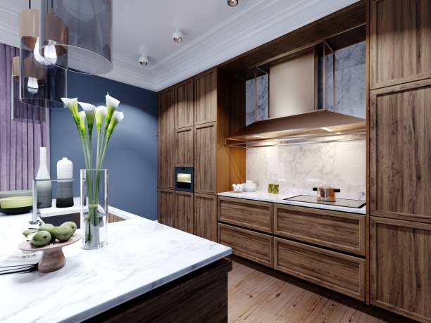 istock Fashionable designer kitchen with an island with a marble working surface, a kitchen in blue and brown colors, wooden furniture. 1263590205